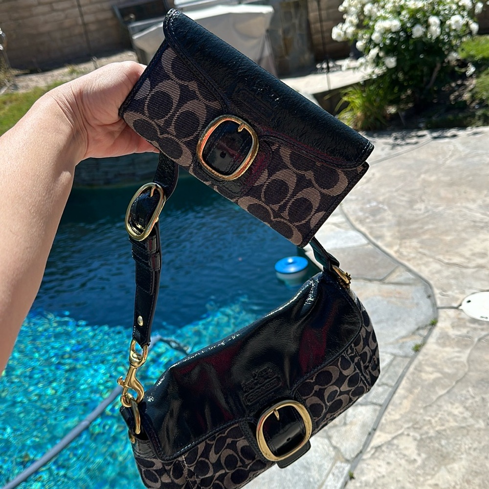 Matching dark blue denim coach handbag and wallet.